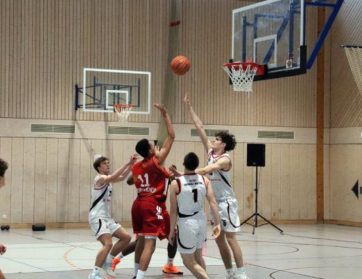 U14 basketball game action at the hoop